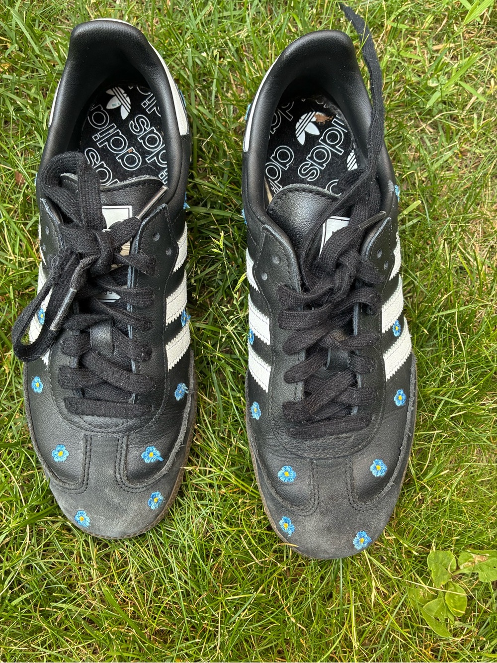adidas Black Leather Sneakers with White Stripes and Blue Flower Accents